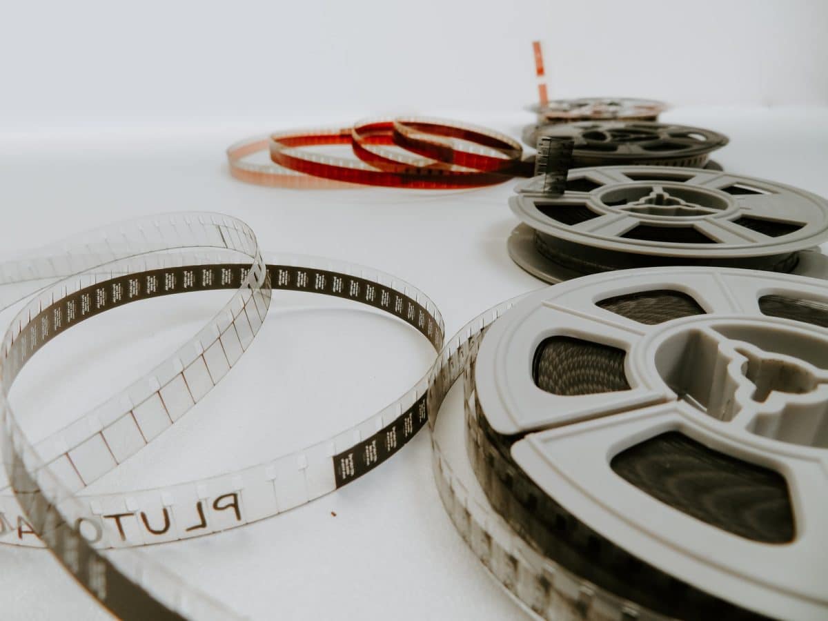 four reel films lying on white table